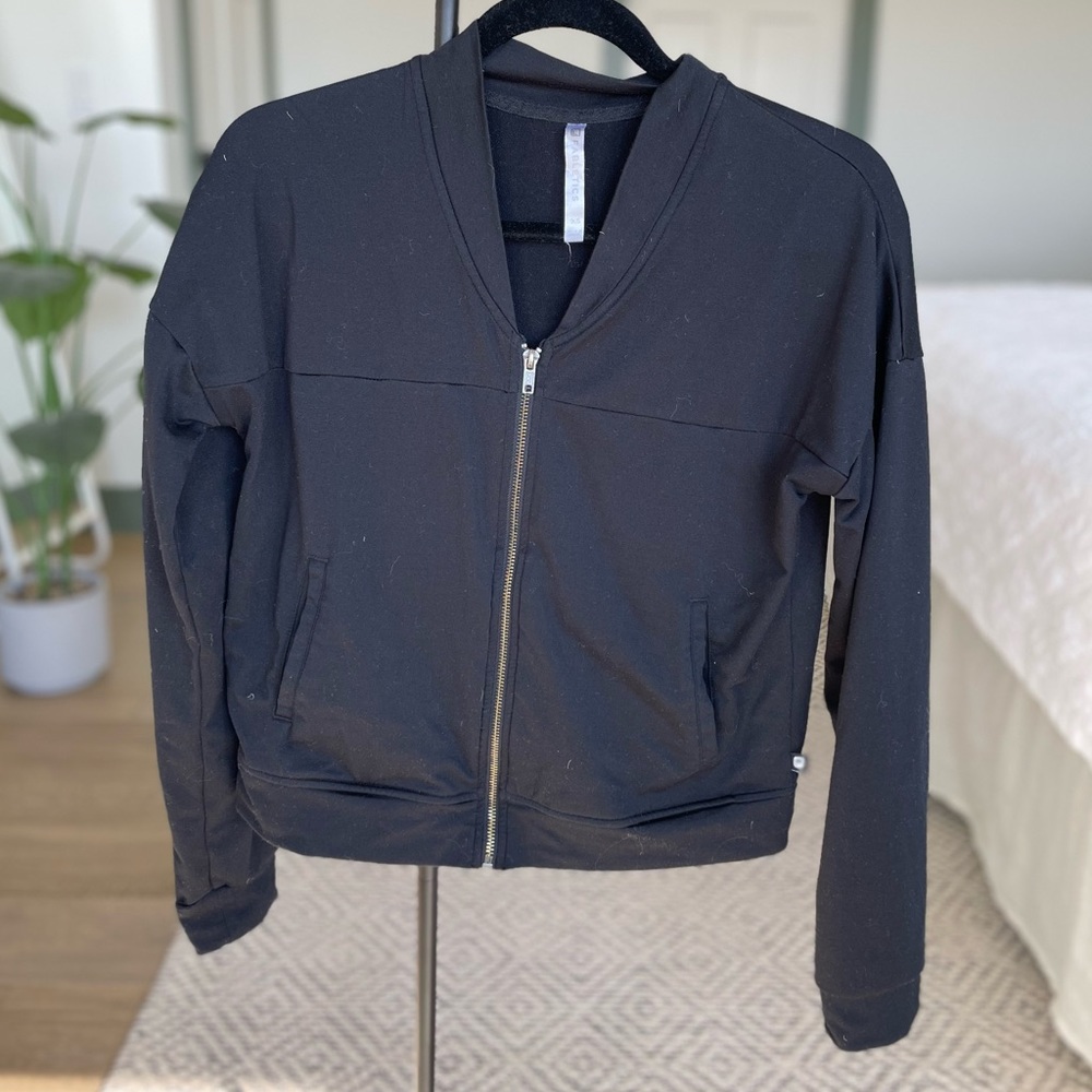 Black athletic zip up sweater.